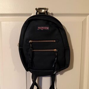 JanSport Mini Backpack with Tassels and Rose Gold Zipper Accents